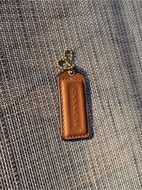 Coach tan/brown Hang Tag